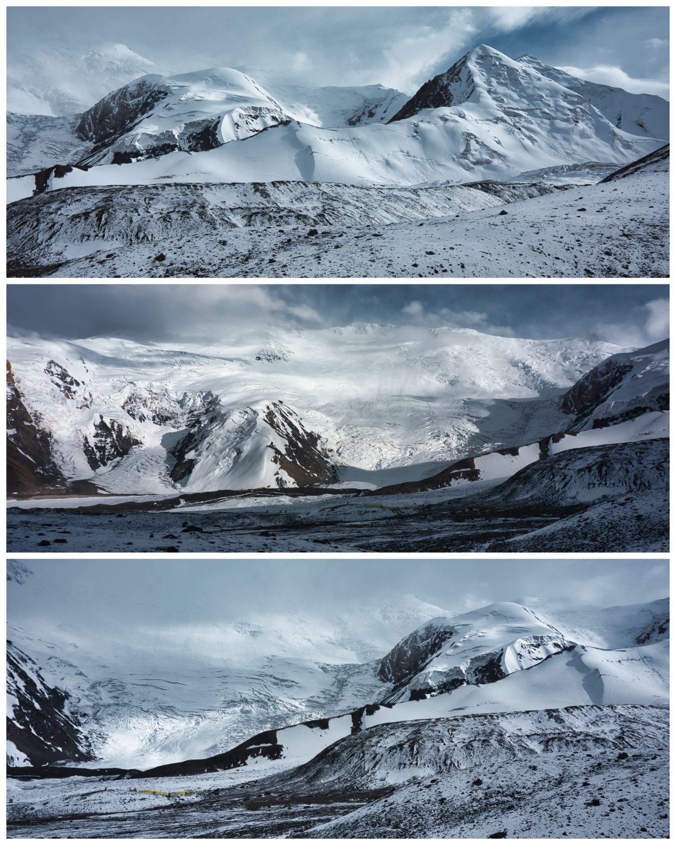Pik Lenin Basecamp (ca. 4.900 m) Schneebedeckte Berglandschaft mit zerklüfteten Gipfeln und Nebel.